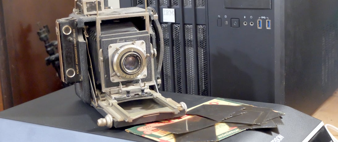 A 2.25 x 3.25 press camera, the hard-to-scan negative that kind of camera produces, and the scanner that I'm using to bring those pictures into the 21st century. (Credit: Dennis E. Powell)