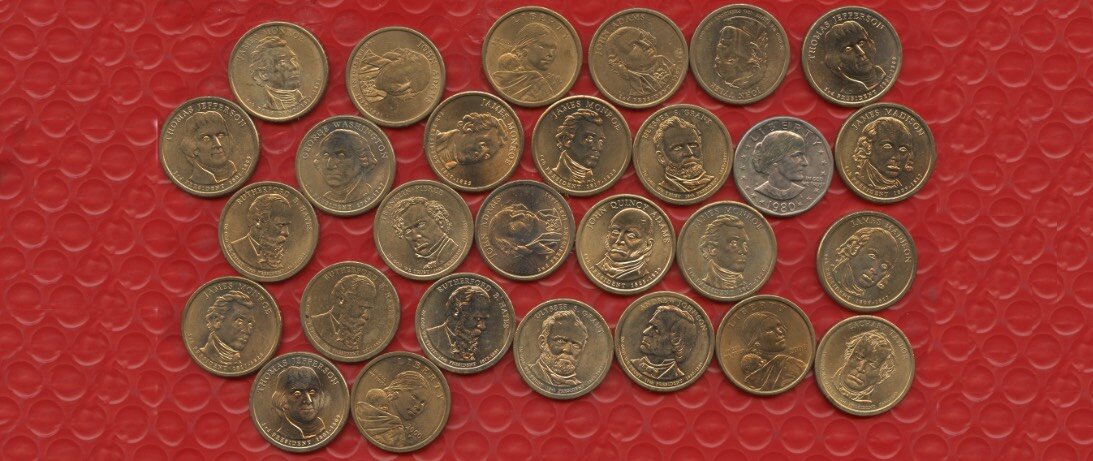 Here are a few of the failed dollar coins made by the U.S. Mint in recent years. Mostly they poorly depict early presidents, but there are a couple Sacagawea dollars that I got in change from a vending machine in Washington, D.C. Also there's one that not's like the others. It is the Susan B. Anthony dollar, the subject of fun and derision because the mint thought it might actually come into widespread use. It didn't. (Credit: Dennis E. Powell)